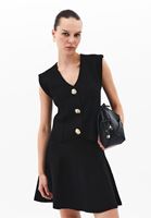 Triko Yelek ve Mini Etek Kombini