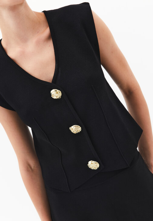 Triko Yelek ve Mini Etek Kombini